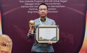 Pj Bupati Pringsewu Dr. Marindo Kurniawan, S.T., M.M. Menerima Penghargaan Universal Health Coverage 2024